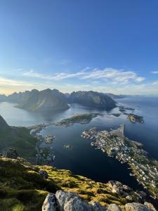 an aerial view of a small island in a body of water at Myranhaugen, house in Reine in Moskenes +22 photos