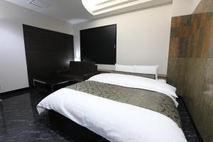 Postel nebo postele na pokoji v ubytování HOTEL C-PLUS - Adult Only