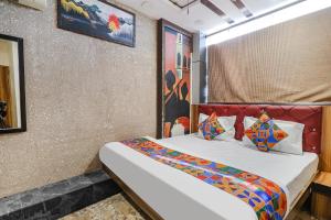 a bedroom with a bed in a room at FabExpress P2 in Bhopal