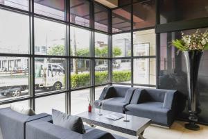 a living room with two couches and a table at Sota stay Hotel in Seoul