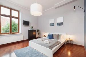Ένα ή περισσότερα κρεβάτια σε δωμάτιο στο Main Square Apartment - Old Town