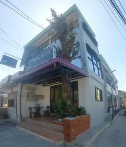 a house with a balcony on top of it at Halajo bnb transient in Laoag