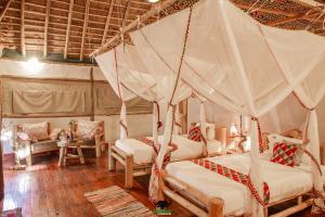 Postelja oz. postelje v sobi nastanitve Embogo Safari Lodges