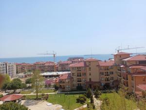 a view of a city with buildings and the ocean at Magic Dreams Apartments in Sveti Vlas