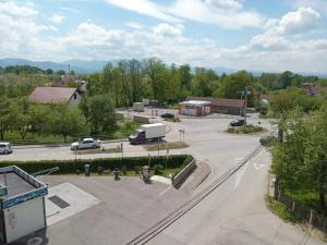 an aerial view of a parking lot with a truck at Apartments Karić Aerodrom Tuzla in Dubrave Gornje