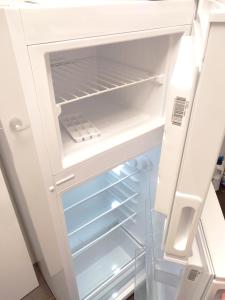 an empty refrigerator with its door open at Alojamiento Dream en Murcia centro in Murcia