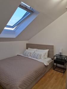 Postel nebo postele na pokoji v ubytování Iris apartman