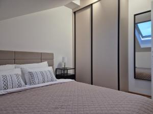 Postel nebo postele na pokoji v ubytování Iris apartman