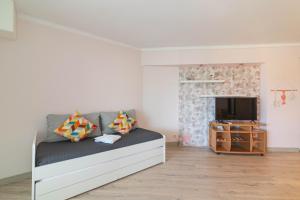 Μια τηλεόραση ή/και κέντρο ψυχαγωγίας στο Patio da Rocha - Silhueta Citadina