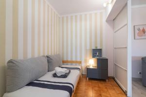 Ένα ή περισσότερα κρεβάτια σε δωμάτιο στο Patio da Rocha - Silhueta Citadina