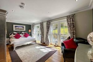 a bedroom with a bed and a couch at Outlander Glencoe at Creag an-t Sionnaich in Glencoe