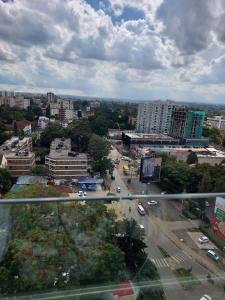 an aerial view of a city with cars on a street at Luxury Apartment Lavington in Mutomo