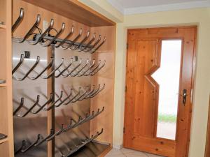a kitchen with a bunch of utensils hanging on the wall at Holiday Home Subretta-5 by Interhome in Kappl