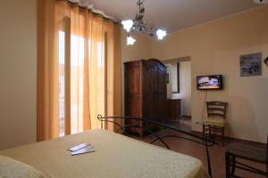 Μια τηλεόραση ή/και κέντρο ψυχαγωγίας στο Affittacamere Casa di Elide