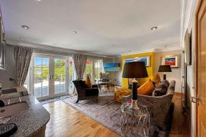 a living room with a couch and chairs and a table at Outlander Glencoe at Creag an-t Sionnaich in Glencoe