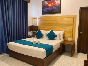 Ένα ή περισσότερα κρεβάτια σε δωμάτιο στο Trinco Beach Resort