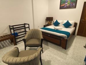 Ένα ή περισσότερα κρεβάτια σε δωμάτιο στο Trinco Beach Resort
