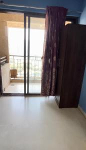an open door to a room with a balcony at 30th floor 2BHK near Viviana Mall with Balcony & Car Parking in Thane