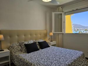 Кровать или кровати в номере Apartment Sol y Mar by Interhome