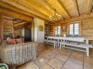 a living room with a table and a couch at Holiday Home Moja Mała Toskania by Interhome in Cisowa