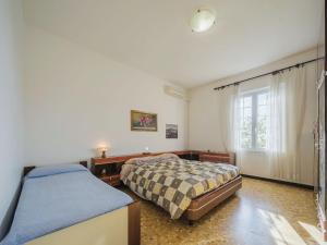 Posteľ alebo postele v izbe v ubytovaní Apartment Compiano by Interhome