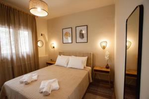 En eller flere senge i et værelse på DayDin Apartments - Din Kastoria
