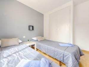 Posteľ alebo postele v izbe v ubytovaní Apartment Mismar-3 by Interhome