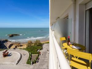 a balcony with a table and a view of the ocean at Studio Bellevue Clemenceau-2 by Interhome in Biarritz