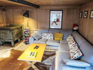 a living room with a couch and a table at Apartment Feu de Joie by Interhome in Disentis