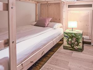 Postel nebo postele na pokoji v ubytování Apartment Chesa Tschierv II 30 by Interhome