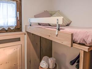 Postel nebo postele na pokoji v ubytování Apartment Chesa Tschierv II 30 by Interhome