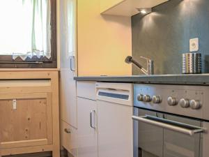 Kuchyň nebo kuchyňský kout v ubytování Apartment Chesa Tschierv II 30 by Interhome