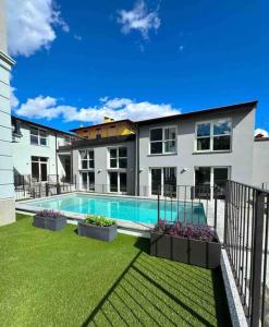 a house with a swimming pool in a yard at Apt Pisces - Oasi di Menaggio in Menaggio