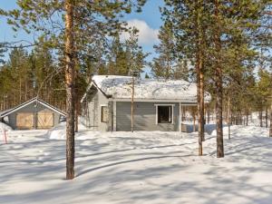a house in the snow with trees at Holiday Home Riekko by Interhome in Enontekiö