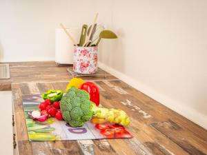 a bunch of vegetables on a cutting board on the floor at Holiday Home Marita by Interhome in Sveti Juraj