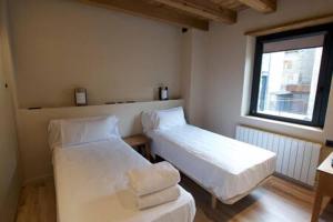 Postel nebo postele na pokoji v ubytování Cal Rus Apartament 3
