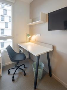 an office with a desk and a chair at All Suites Appart Hôtel - Le Havre Centre - Les docks in Le Havre