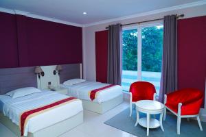 Voodi või voodid majutusasutuse Tilko City Hotel Jaffna toas
