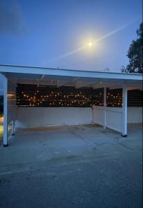a garage with a building with a light above it at Thalia's House in Pastida