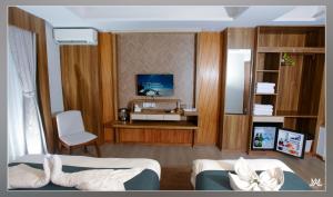 a hotel room with two beds and a television at Hotel Maya Boutique and Apartment, Thamel in Kathmandu