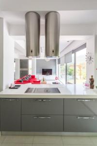 a kitchen with a sink and a counter top at Messinian Project in Khóra