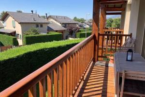 a wooden railing on a house with a lawn at Casita Planes Surroca in Bourg-Madame