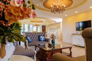 a living room with a couch and a table at NANJING HOTEL LUGOGO in Kampala