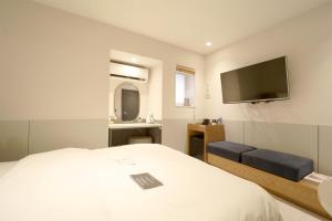 En eller flere senge i et værelse på No 25 Hotel Namyangju Bukhan River