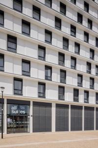 an exterior view of a hotel building at All Suites Appart Hôtel - Le Havre Centre - Les docks in Le Havre