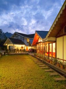 a house with a lawn in front of it at Eagle's Nest in Bhurtuk