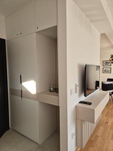 TV a/nebo společenská místnost v ubytování Iris apartman