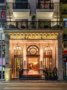 an entrance to a building with a sign that reads premier gallery classic at Peridot Gallery Classic Hotel in Hanoi