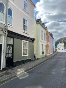 an empty street with buildings on the side of the road at Ferrymans Rest in Dartmouth