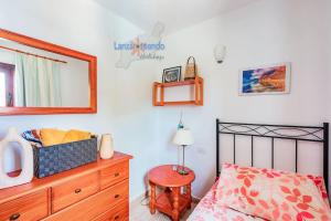 Postel nebo postele na pokoji v ubytování Casita el Faro en Playa Bastian aircon in the bedrooms VV